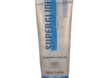 Ein transparenter silberner schlauch mit blauem deckel und schriftzug superglue als wasserbasiertes gleitmittel hot variant