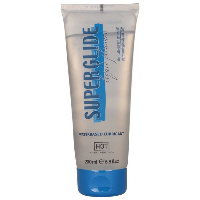 Ein transparenter silberner schlauch mit blauem deckel und schriftzug superglue als wasserbasiertes gleitmittel hot variant