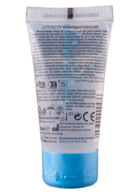 Ein transluzenter blauer schlauch mit superglide wasserbasiertem gleitmittel und silberner, gerillter kappe