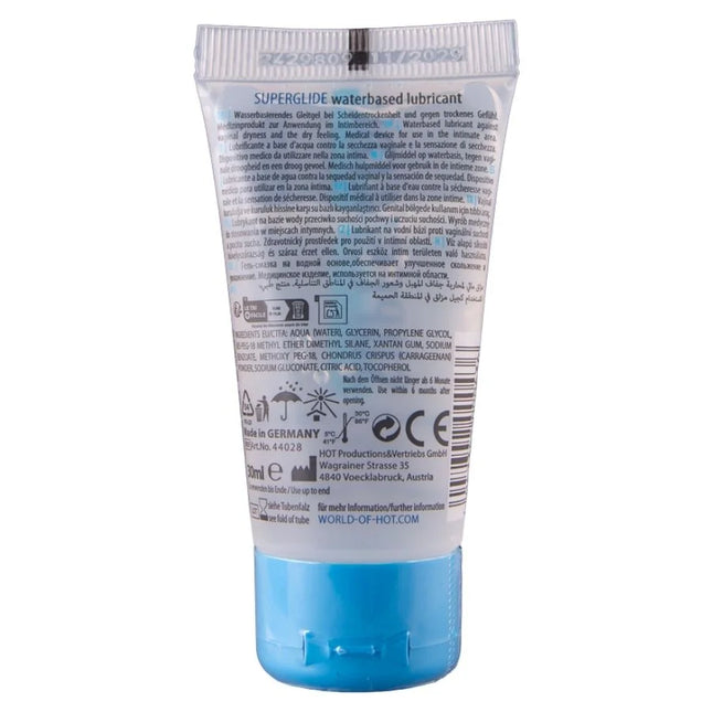 Ein transluzenter blauer schlauch mit superglide wasserbasiertem gleitmittel und silberner, gerillter kappe