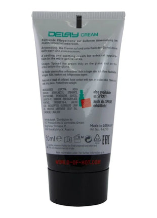 Tube aus silber und schwarz mit matter oberfläche und grünem text für hot verzögernde creme 50 ml