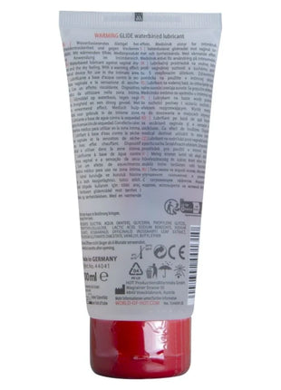 Ein roter transparenter kunststofftube mit weißem etikett und schwarzem text für warmendes wasserbasiertes gleitmittel hot 100 ml