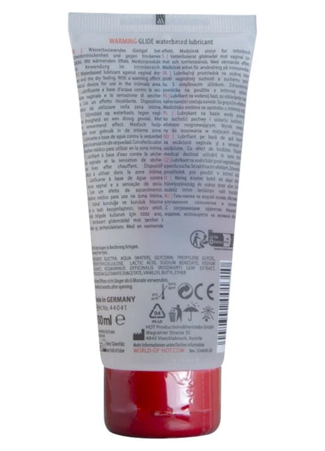 Ein roter transparenter kunststofftube mit weißem etikett und schwarzem text für warmendes wasserbasiertes gleitmittel hot 100 ml
