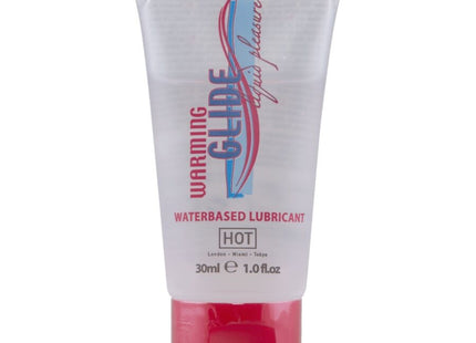 Transparenter kunststofftube mit rotem verschluss und blauem pinkem weißem branding für warming glide wasserbasiertes gleitmittel hot 30 ml