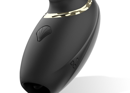 Schwarzer silikon-saugnapf mit goldfarbener metallakzentband und muschelförmigem knopf aus ibiza 3in1 vibe