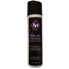 Schwarz-weiße zylindrische flasche id silk natürliches gefühl wasserbasiertes schmiermittel mit lila diamant-logo 250 ml