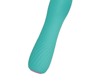 Teal silikon vibrator mit strukturierter griff und pinkem akzent am boden aus der inspire essential leila turquoise serie