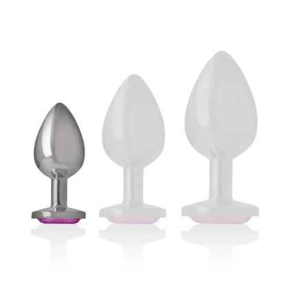 Set aus drei analplugs mit intensiv aluminiummetall, ein silberner mit rosafarbenem kristallboden und zwei weiße durchsichtig