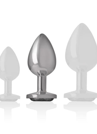 Intense analplug aus aluminiummetall mit schwarzem glas und zwei weißen teardrop-förmigen silikonaufsätzen