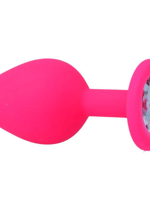 Ein pinker silicone analplug intense shelki m mit rundem fuß und klarem kristall in fuchsiafarbe
