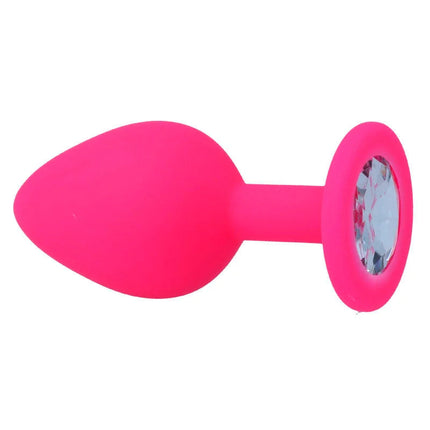 Ein pinker silicone analplug intense shelki m mit rundem fuß und klarem kristall in fuchsiafarbe