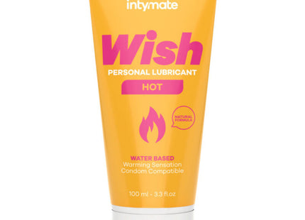 Ein lebhaft orangefarbener schlauch intymate wish heißes wasserbasiertes gleitmittel mit weißem deckel und pinkem logo, kondomkompatibel