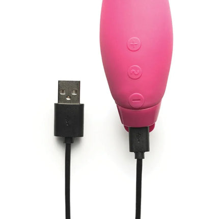 Je joue hera rabbit vibrator pink silicone with three control buttons and usb charging cable shown from the back side