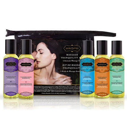 Set aus fünf bunten glasflaschen mit schwarzen kapseln und verschiedenen aromatischen massageölen von kamisama berührendes massageset