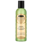 Eine durchscheinend grüne flasche kamasutra natürliches massageöl vanille sandelholz 59 ml mit schwarzem deckel und goldgeprägtem etiket