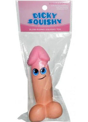 KHEPER GAMES - pinke dicky squishy spielzeug mit blauen Augen und Lächeln in klarem Plastik verpackt
