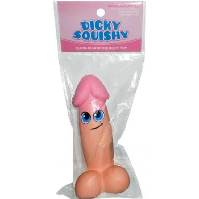 KHEPER GAMES - pinke dicky squishy spielzeug mit blauen Augen und Lächeln in klarem Plastik verpackt