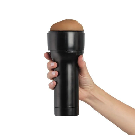 Schwarzer zylindrischer kiiroo feel stroker masturbator stimulator mit hellbraunem silikonkopf und glatter glänzender oberfläche