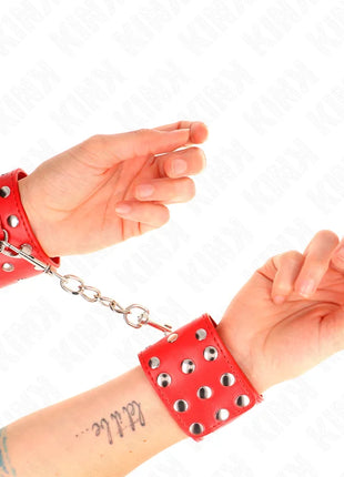 KINK - HANDGELENKFESSELN MIT DRUCKVERSCHLUSS VOLLER NIETEN ROT VERSTELLBAR 19-24 CM X 5,5 CM