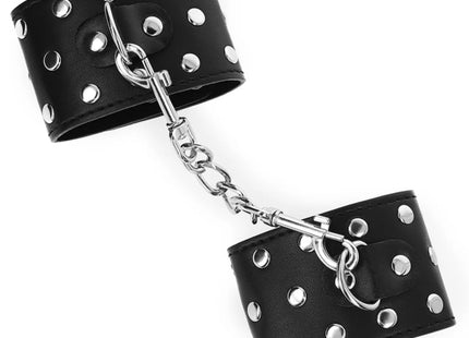 KINK - HANDGELENKFESSELN MIT DRUCKVERSCHLUSS VOLLER NIETEN SCHWARZ VERSTELLBAR 19-24 CM X 5,5 CM