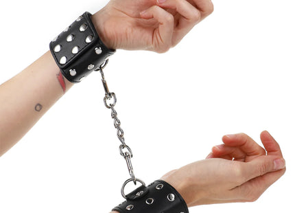 KINK - HANDGELENKFESSELN MIT DRUCKVERSCHLUSS VOLLER NIETEN SCHWARZ VERSTELLBAR 19-24 CM X 5,5 CM