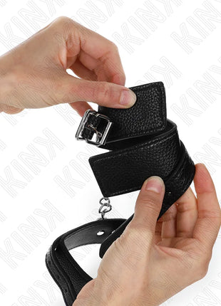 KINK - HANDGELENKFESSELN MIT SCHLANGENMUSTER SCHWARZ VERSTELLBAR 20-28 CM X 5,4 CM