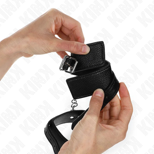 KINK - HANDGELENKFESSELN MIT SCHLANGENMUSTER SCHWARZ VERSTELLBAR 20-28 CM X 5,4 CM