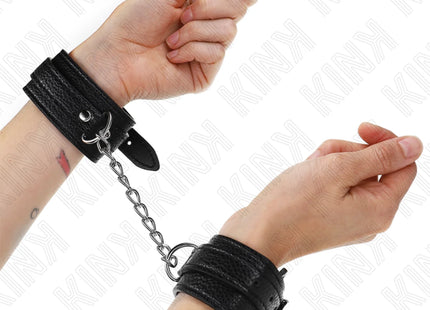 KINK - HANDGELENKFESSELN MIT SCHLANGENMUSTER SCHWARZ VERSTELLBAR 20-28 CM X 5,4 CM
