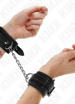 KINK - HANDGELENKFESSELN MIT SCHLANGENMUSTER SCHWARZ VERSTELLBAR 20-28 CM X 5,4 CM