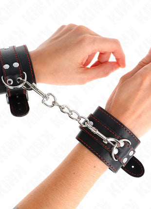 KINK - HANDGELENKFESSELN SCHWARZ MIT ROTEM FUTTER VERSTELLBAR 20-28 CM X 5,5 CM