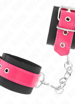 KINK - NYLON HANDGELENKFESSELN SCHWARZ MIT KUNSTLEDERGÜRTEL HIMBEERROSA VERSTELLBAR 19-29 CM X 5,1 CM