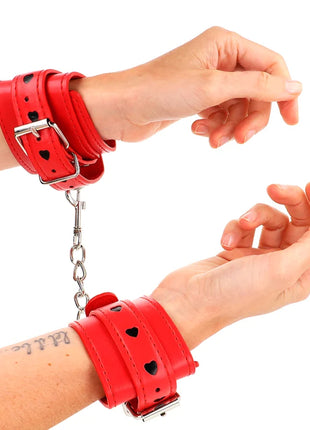 KINK - ROTE HANDGELENKSFESSELN MIT SCHWARZER HERZEINLAGE VERSTELLBAR 21-28 CM X 5,5 CM
