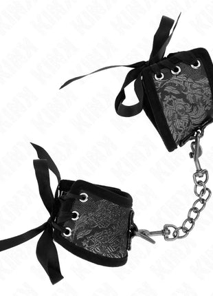 KINK - SCANDAL HANDGELENKSFESSELN SCHWARZE SPITZENDETAILS 24,5 CM X 6,5 CM