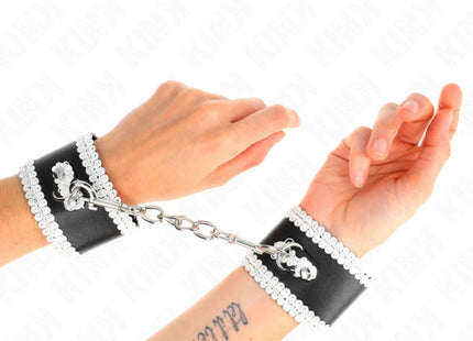 KINK - SCHWARZE HANDGELENKFESSELN MIT WEISSER DEKORIERTER SPITZE VERSTELLBAR 20-23 CM X 5,5 CM