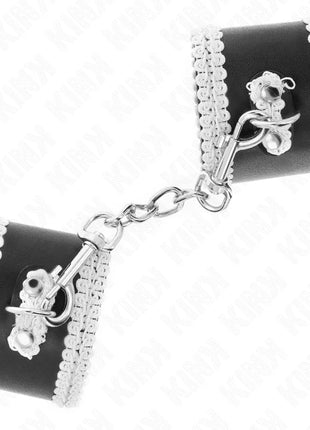 KINK - SCHWARZE HANDGELENKFESSELN MIT WEISSER DEKORIERTER SPITZE VERSTELLBAR 20-23 CM X 5,5 CM