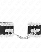 KINK - SCHWARZE HANDGELENKFESSELN MIT WEISSER DEKORIERTER SPITZE VERSTELLBAR 20-23 CM X 5,5 CM