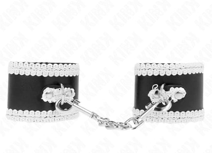 KINK - SCHWARZE HANDGELENKFESSELN MIT WEISSER DEKORIERTER SPITZE VERSTELLBAR 20-23 CM X 5,5 CM