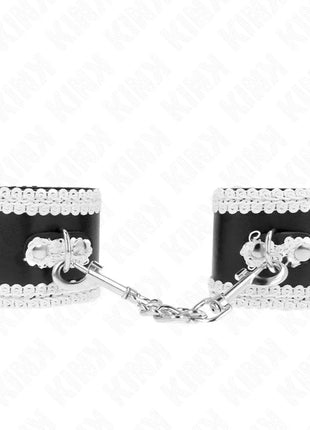 KINK - SCHWARZE HANDGELENKFESSELN MIT WEISSER DEKORIERTER SPITZE VERSTELLBAR 20-23 CM X 5,5 CM