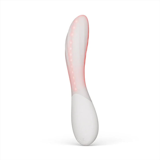 Ein weißes und pinkes lelo mona spectra intimen wohlbefindens massagerät mit ergonomischem design und app-steuerung