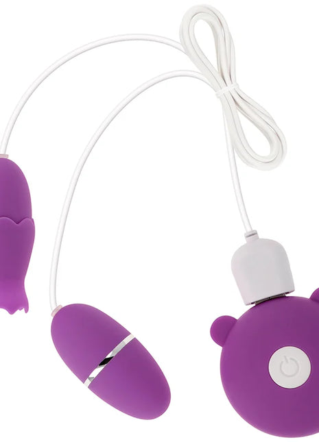 Lila silikonfernbedienung in bärenform mit weißem powerknopf und zwei verbundenen ei-vibrator für ohmama doppelstimulator