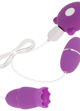 Ohmama doppelsimulator lila silikon vibrator mit weißer ladestation und silbernem akzentband mit 10 vibrationsmodi