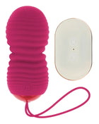 Vibrierei in kräftigem rosa silikon mit sieben modi und passendem armband sowie fernbedienung von ohmama