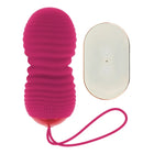 Vibrierei in kräftigem rosa silikon mit sieben modi und passendem armband sowie fernbedienung von ohmama