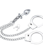 Ohmama fetish handschellen aus silbernem metall mit kettenglied und poliertem analstecker
