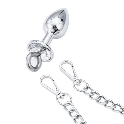 Silverplattierter analplug mit klarem kristalldetail und metallkette aus der ohmama fetish handschellen mit metall und stecker serie