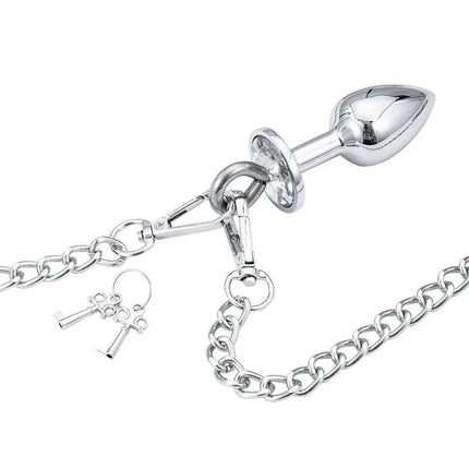 Silberner metallischer analplug mit kette und zwei schlüsselanhängern aus dem ohmama fetish handschellen set