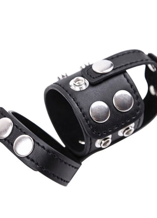 Schwarzes leder-armband mit silbernen metallnieten und druckknöpfen ohmama fetish keuschheitshülle