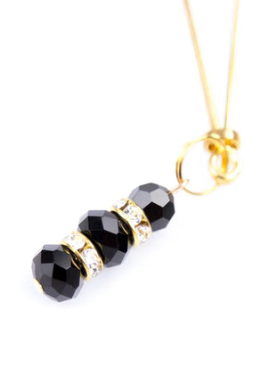Ohmama fetish black faceted bead nipple clamps with gold-toned metal and clear crystal pendant on gold chain
