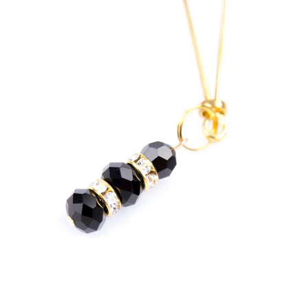 Ohmama fetish black faceted bead nipple clamps with gold-toned metal and clear crystal pendant on gold chain