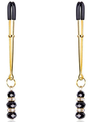 Schwarze und goldene ohmama fetish nippelklemmens mit facettierten schwarzen perlen und klaren kristallen
